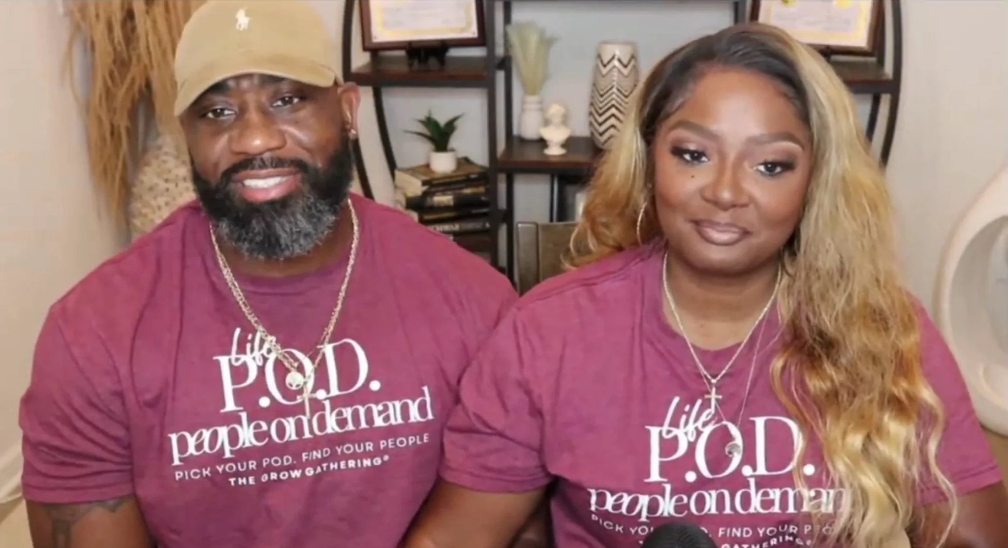 Two people wearing matching People On Demand Grow Gathering shirts